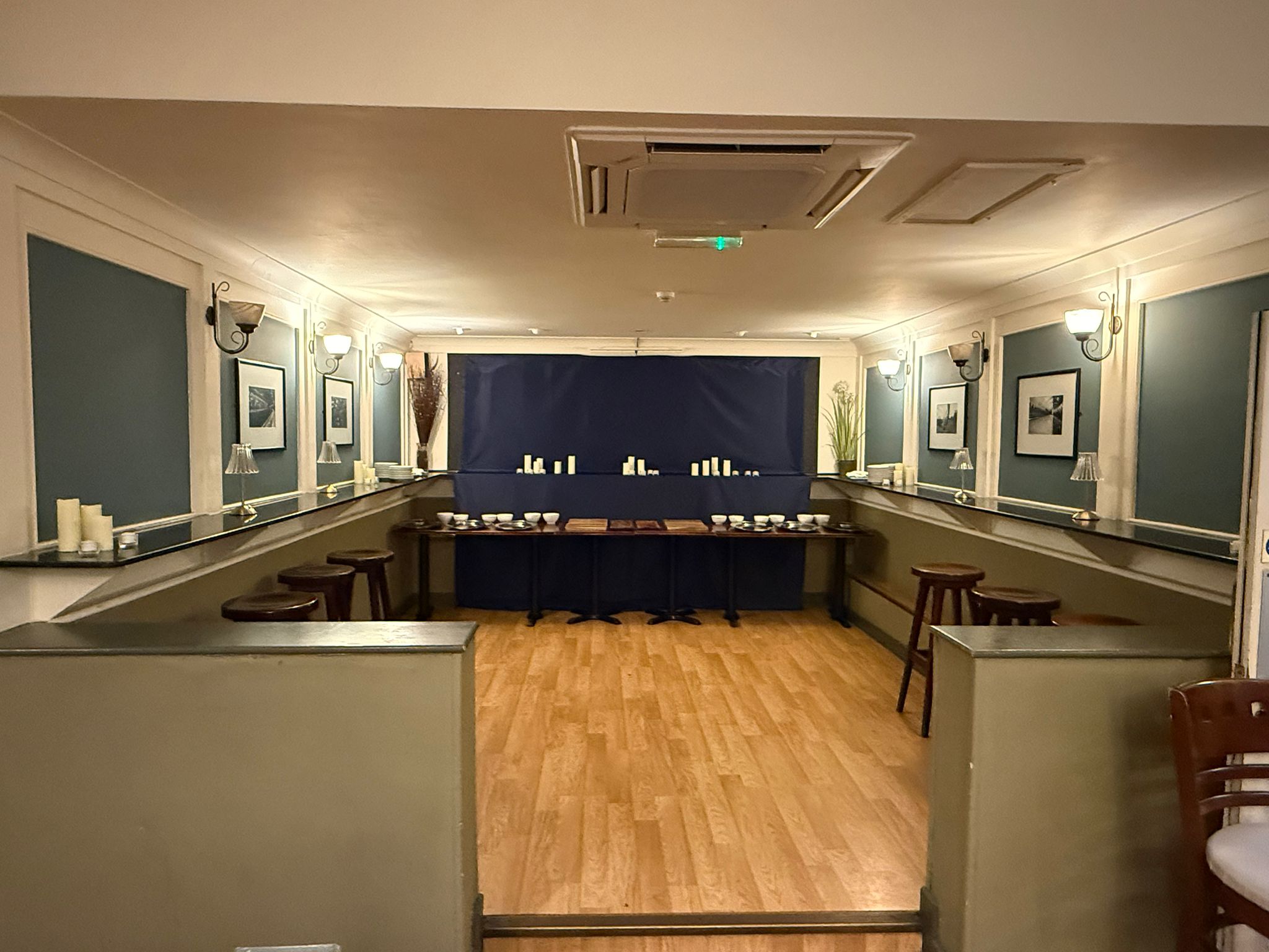 Steam Wine Bar private room — U-shaped table arrangement with wall lighting, ideal for corporate dinners and private functions